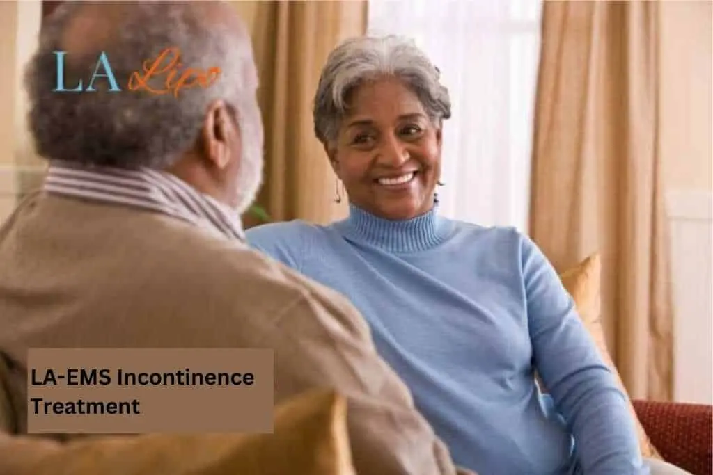 Couple sat smiling at each other - LA-EMS treatment Essex
