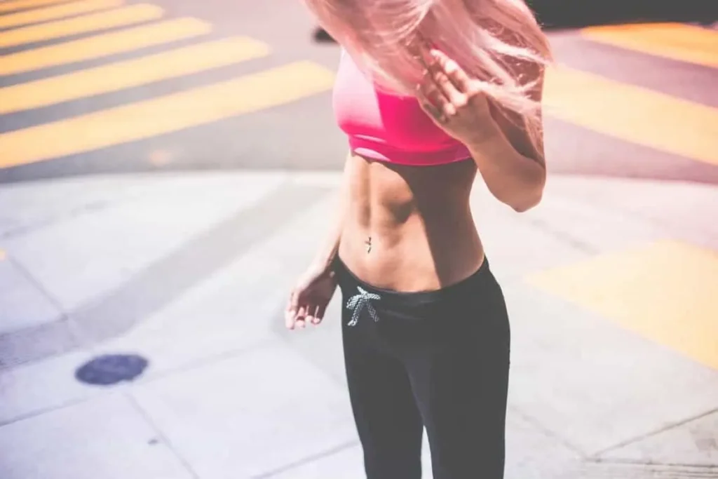 Woman with toned stomach after LA-EMS Body Sculpting Treatment Essex