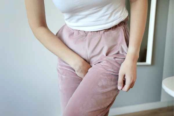 woman running for the toilet because of urinary incontinence Essex